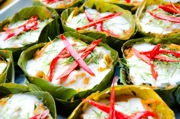 Hor mok, thai food, steamed fish curry custard in banana leaf
