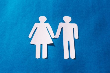 Happy Human Couple Paper Craft Mockup on Blue background. Origami Papercraft decorative shapes and figure. Copy Space.