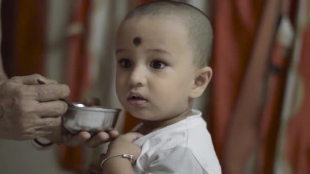 Happy Cute Baby Eating Food Head Shoulder Shot Close — Stockvideo