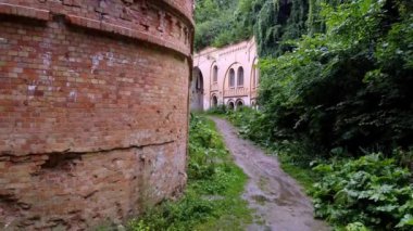Brick wall and trees in Tarakaniv fortress in Ukraine