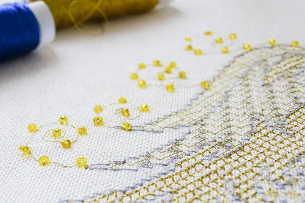 A fragment of work in the technique of gold embroidery with beads and metallic threads — стоковое фото
