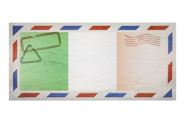 Postal envelope. Envelope with the image flag of Ireland. Irish flag. Old crumpled envelope with stamps. Copy space. Blank mock up. Creative template.