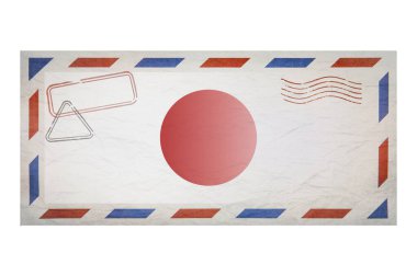 Postal envelope. Envelope with the image flag of Japan. Japanese flag. Old crumpled envelope with stamps. Copy space. Blank mock up. Creative template.