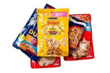 Cat food. Animal feed in colored bags isolated on white background. Kyiv. Ukraine. April 25, 2022
