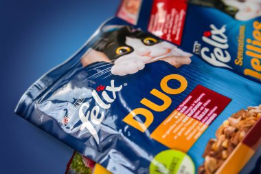 Cat food. Close-up of animal feed PURINA FELIX on a blue background. Kyiv. Ukraine. April 25, 2022
