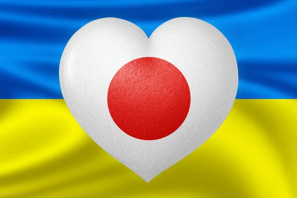 Flags of Ukraine and Japan. Heart color of the flag on the background of the flag of Ukraine. The concept of protection and solidarity. Military and humanitarian assistance.
