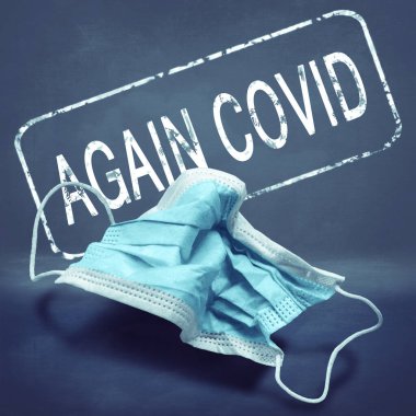 Lettering Again Covid and crumpled medical mask. The return of the coronavirus. New jump in incidence. Strain Omicron and Dedta. Danger of viral infection. Health care and medical concept