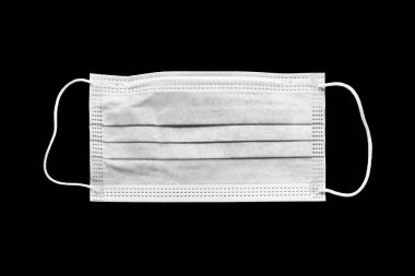 Medical mask. Disposable surgical mask. Protection from respiratory infections. Isolate on black and white. Danger of a viral infection. Health care and medical concept