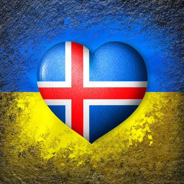 Flags of Ukraine and Iceland. Flag heart on the background of the Ukrainian flag painted on a stone. The concept of protection and solidarity. Military and humanitarian assistance.