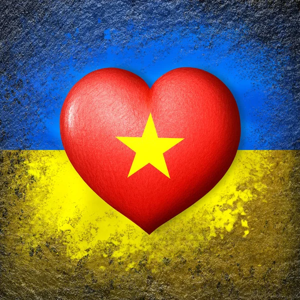 Flags of Ukraine and Vietnam. Flag heart on the background of the Ukrainian flag painted on a stone. The concept of protection and solidarity. Military and humanitarian assistance.