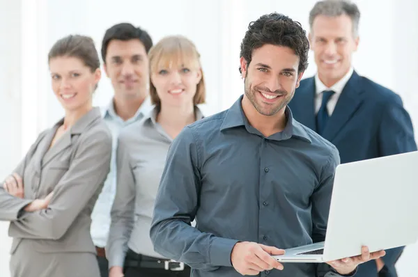 Business man holding a modern laptop Royalty Free Εικόνες Αρχείου