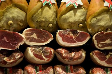 Italian ham at the butcher's clipart