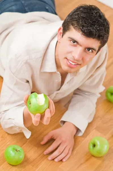 Man eating apples — Stock Photo, Image