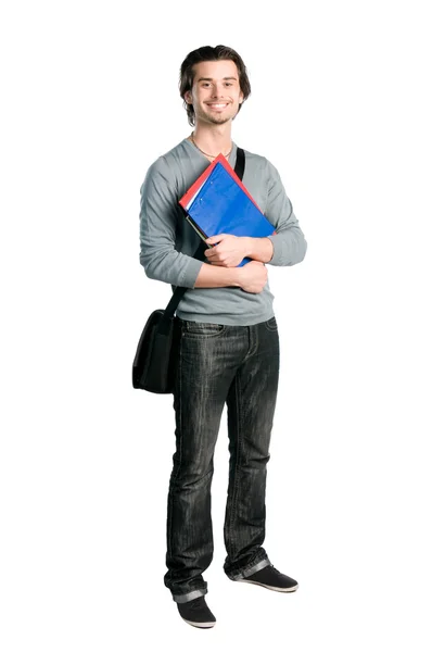 Усміхнений щасливий студент стоїть з нотатками — стокове фото
