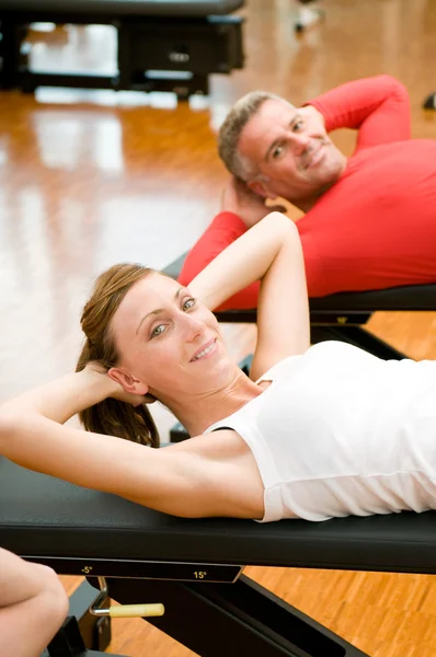 Exercising at gym — Stock Photo, Image