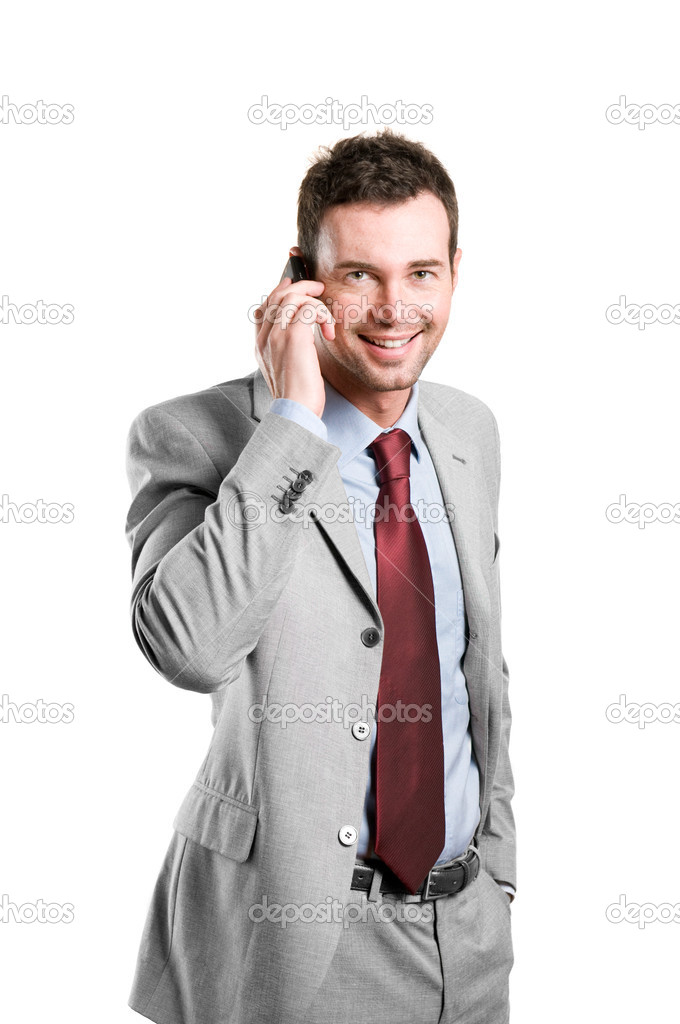 Happy businessman talking on mobile