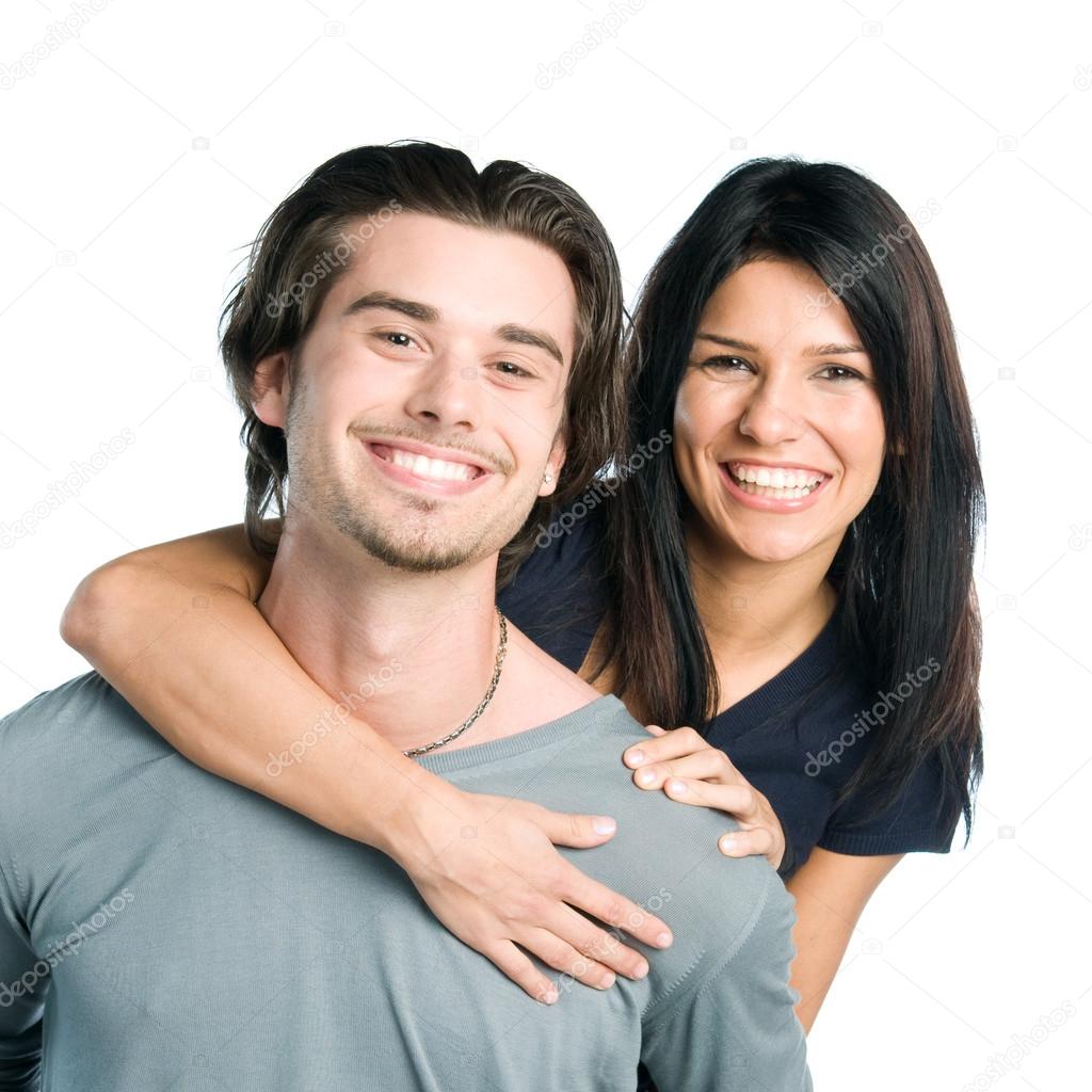 Smiling young latin couple piggyback
