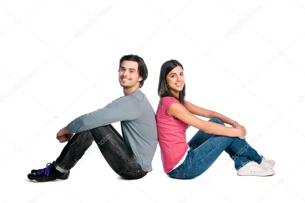 Smiling young couple sitting together