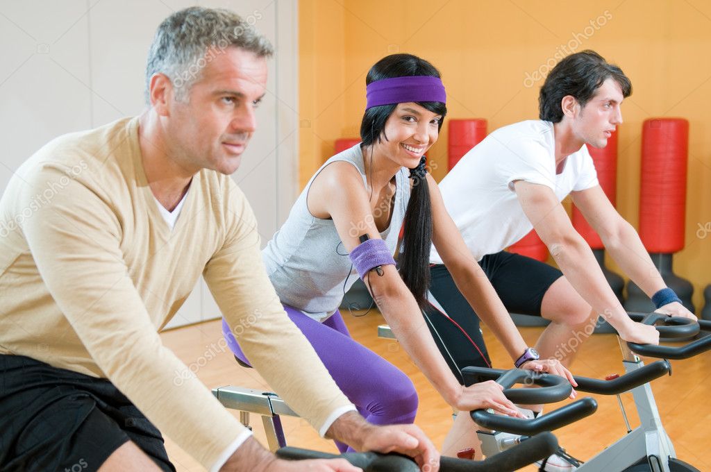 Spinning excercise group at gym — Stock Photo © ridofranz 12658974