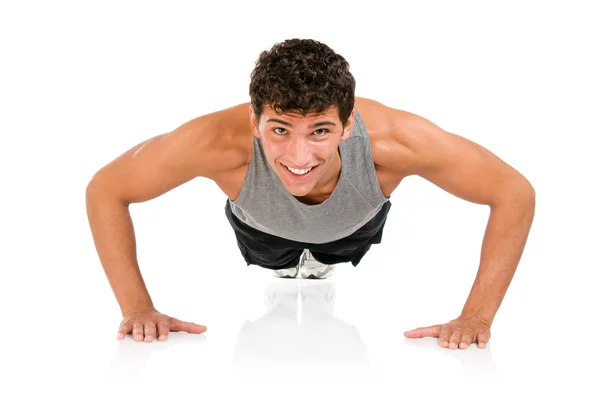 Homem feliz fazendo flexões — Fotografia de Stock