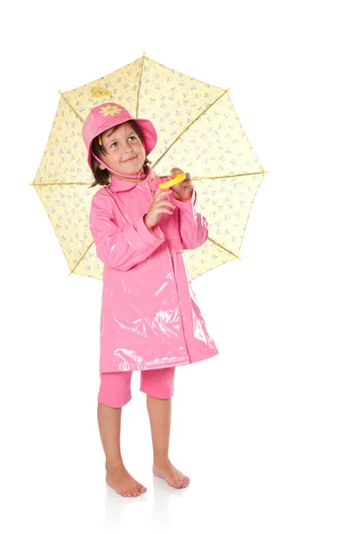 Menina com capa de chuva e guarda-chuva — Fotografia de Stock