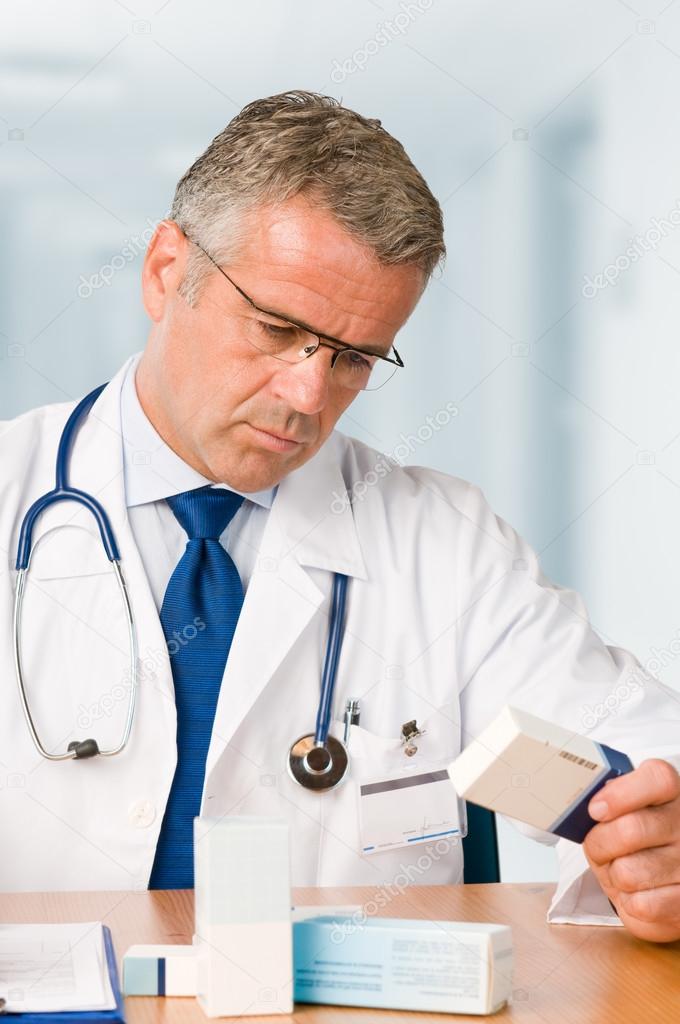 Doctor examining medicine cases
