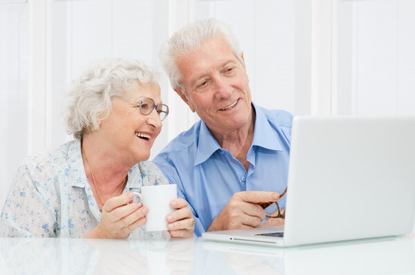 Senior couple at laptop