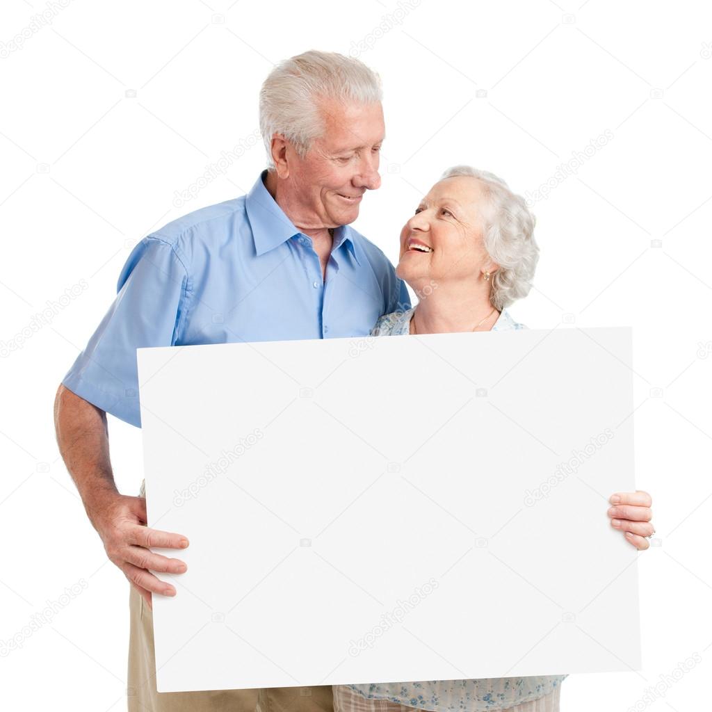 Senior couple with placard