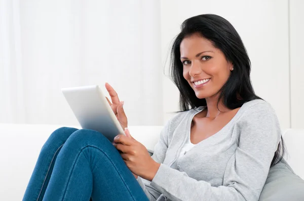 Young woman with modern tablet — Stockfoto
