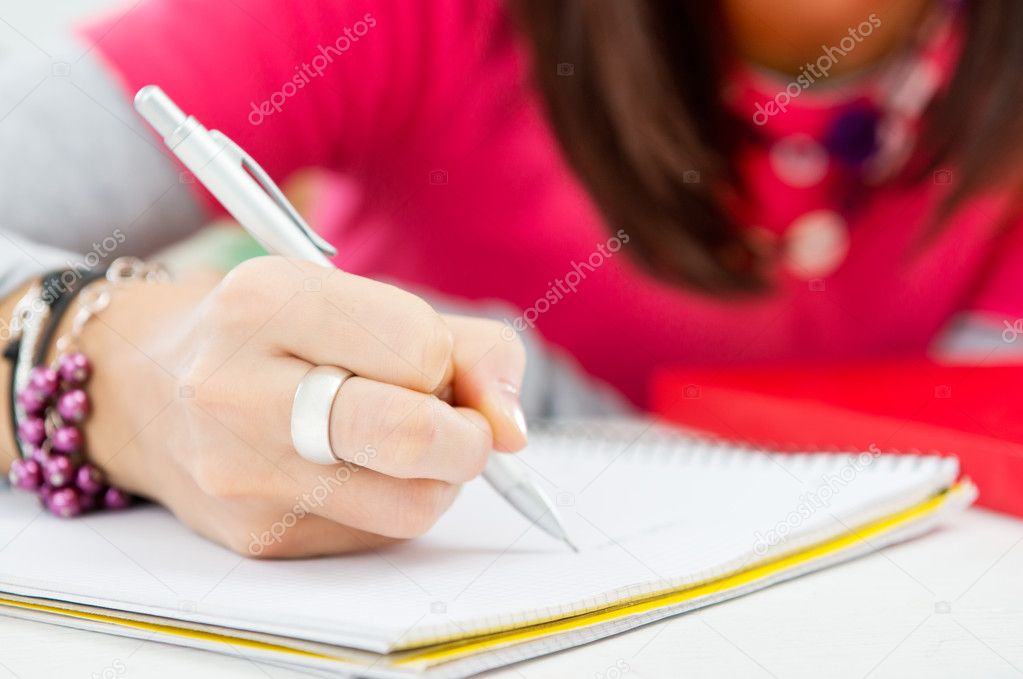 Closeup Of Girl Hand Writing