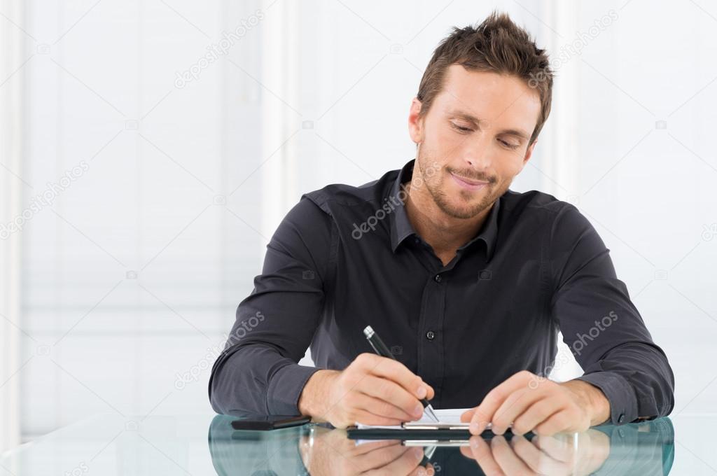 Businessman Writing Document