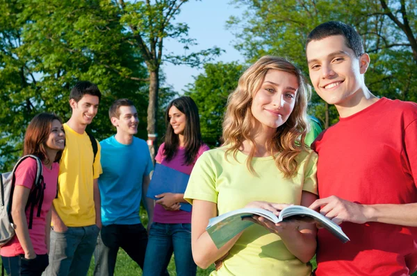 Happy students outdoor Stock Image