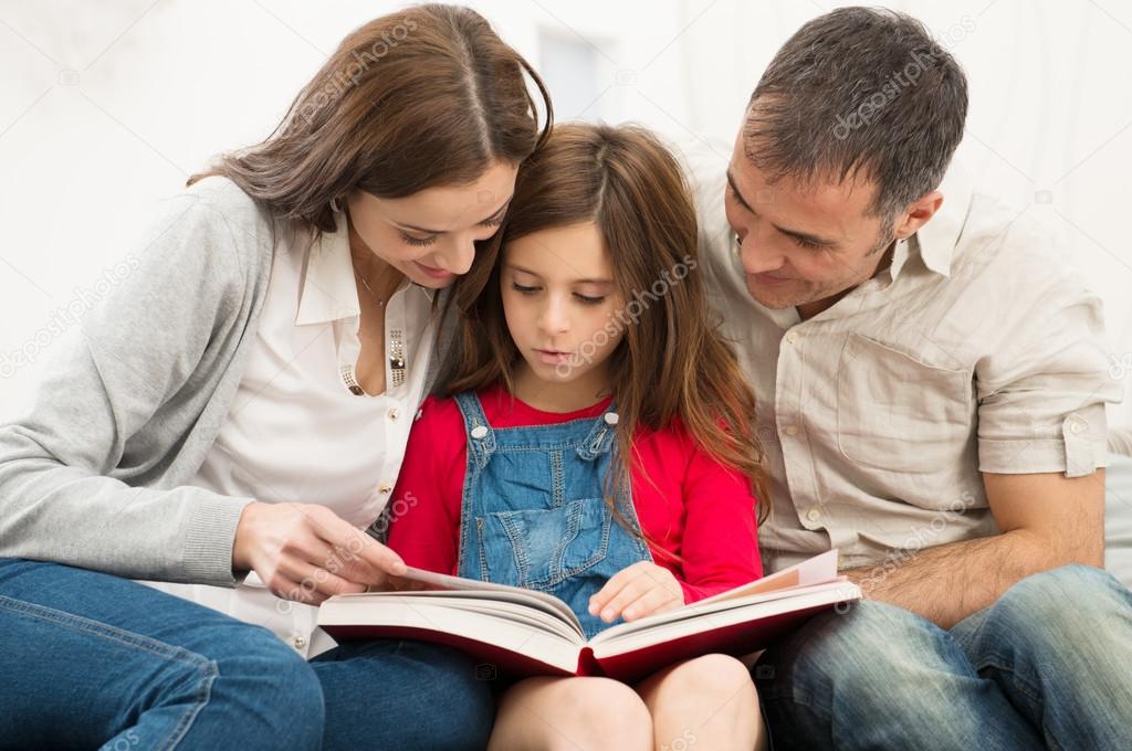 Parents Helping Daughter In Studies