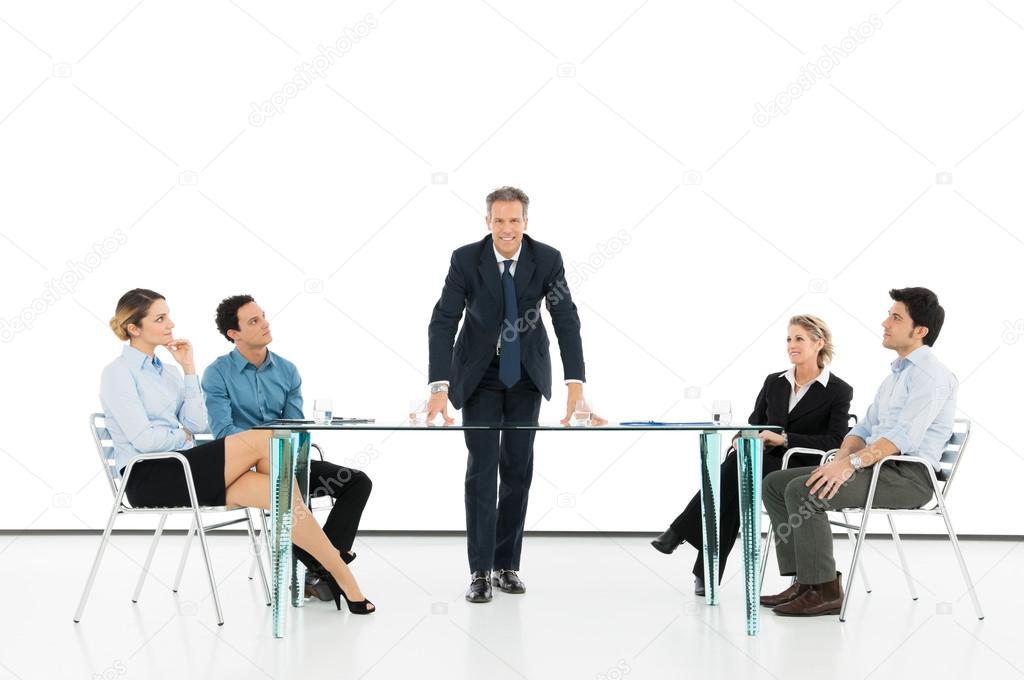 Manager With Colleague In Business Meeting