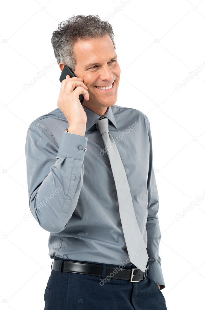 Senior Businessman Conversing On Phone
