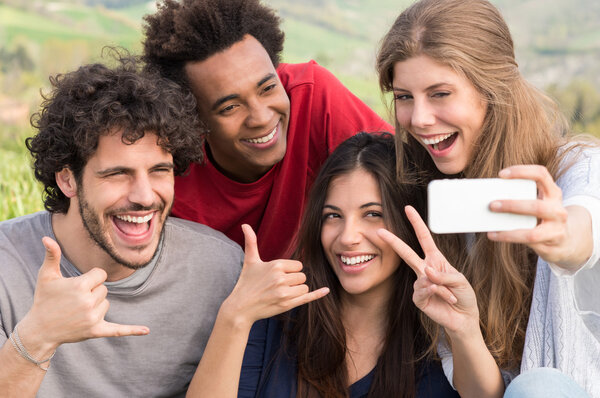 Friends Taking A Selfie With Mobile Phone