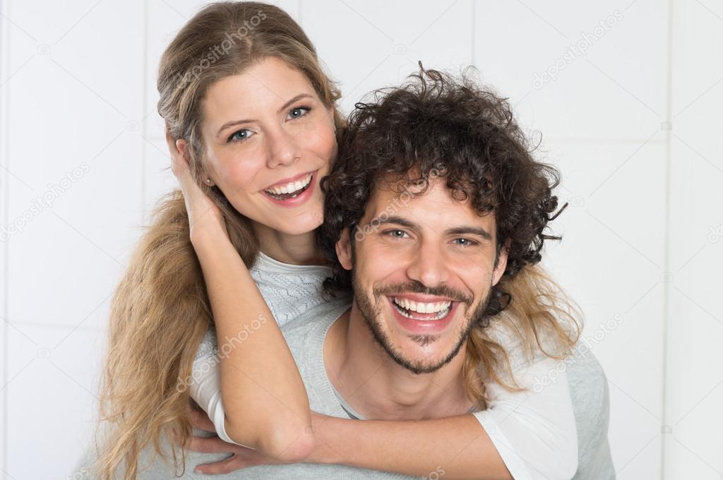 Man Carrying Woman On Back