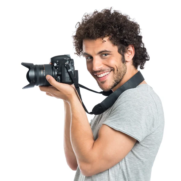 Jovem segurando Reflex — Fotografia de Stock