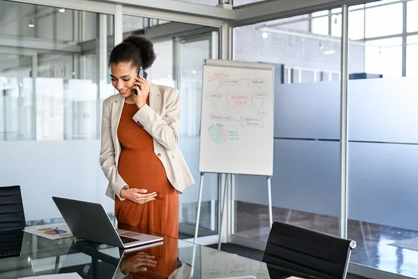 Smiling Pregnant Businesswoman Touching Belly While Using Laptop Talking Phone — Stock fotografie