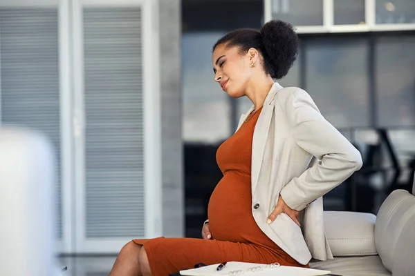 Young Pregnant Woman Sitting Couch Suffering Pain While Working Office — Stok fotoğraf