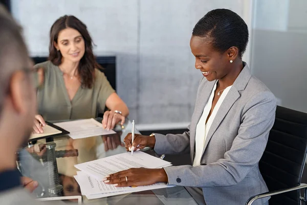 Smiling Mid Adult Businesswoman Signing Agreement Document Meeting Happy Mature — Foto Stock