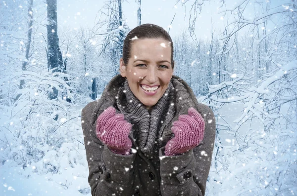 Woman and snowfall — Stock Photo, Image