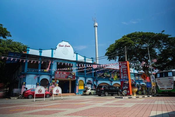 Malacca, Malaysia - August 10, 2022: View from Samudera Square to the Menara Taming Sari  observation tower. The observation platform moving up for tourist to get an aerial view of Melaka