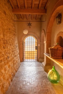 Beautiful sun light inside of an ancient castle near Montalcino, Tuscany, Italy. Old stone medieval castle.