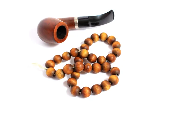 Smoking pipe and Rosary Beads — Stock Photo, Image