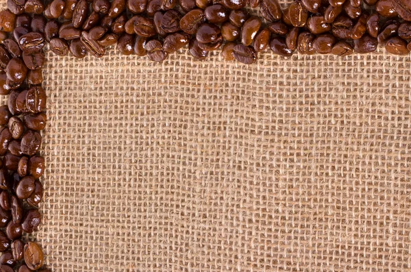 Coffee beans. On sackcloth, background — Stock Photo, Image