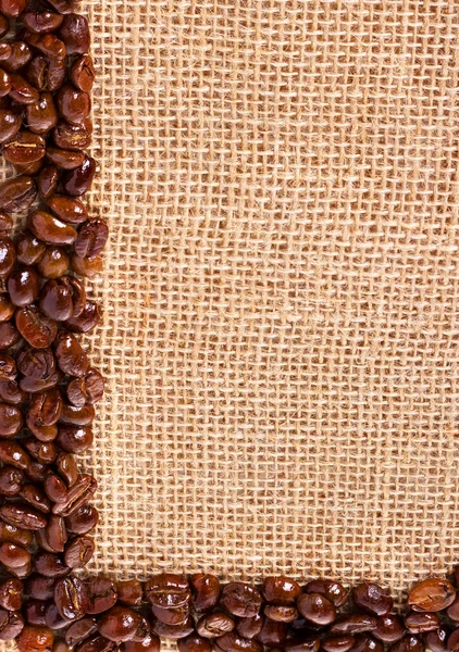 Coffee beans. On sackcloth, background — Stock Photo, Image