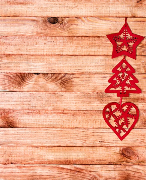 Kerstmis grens met decoratie, ornament op een houten achtergrond — Stockfoto