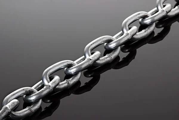 Links of steel chain close-up on white background — Stock Photo, Image