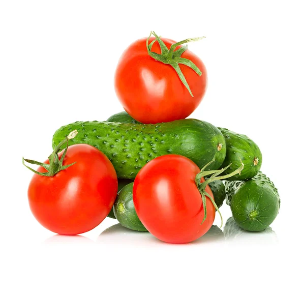 Red tomatoes and green cucumbers — Stock Photo, Image